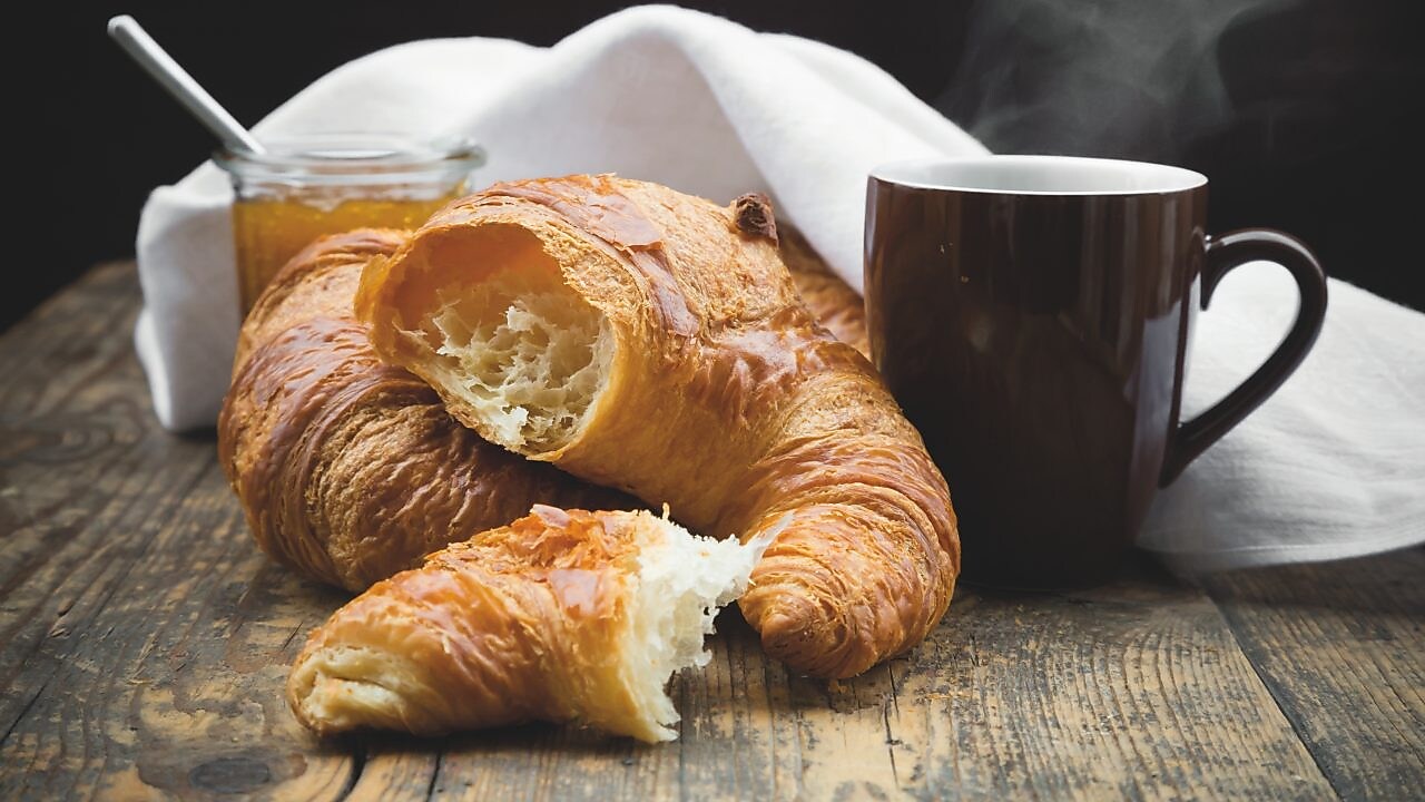 Croissant and Mug on a wooden table