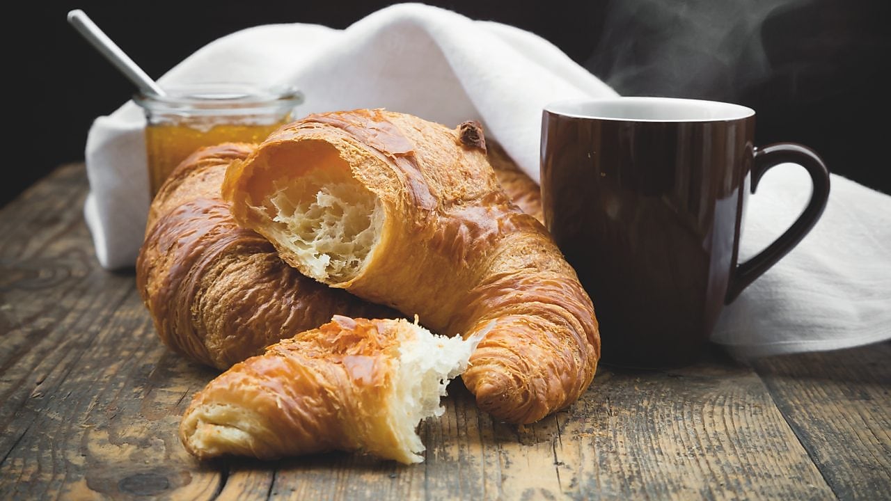 Croissant and Mug on a wooden table